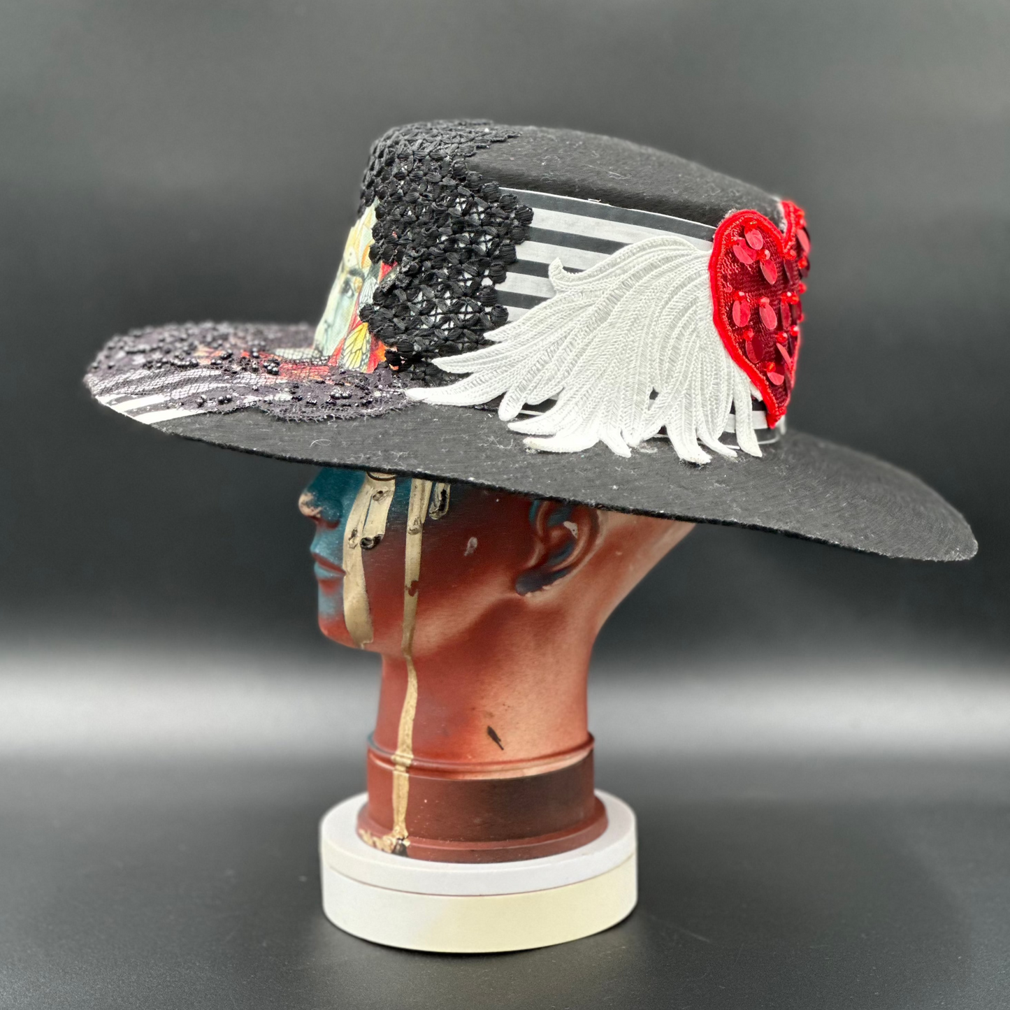 Side view of the Coyoacán Frida Kahlo Hat on a mannequin head, highlighting the rose placement and the hat's silhouette.