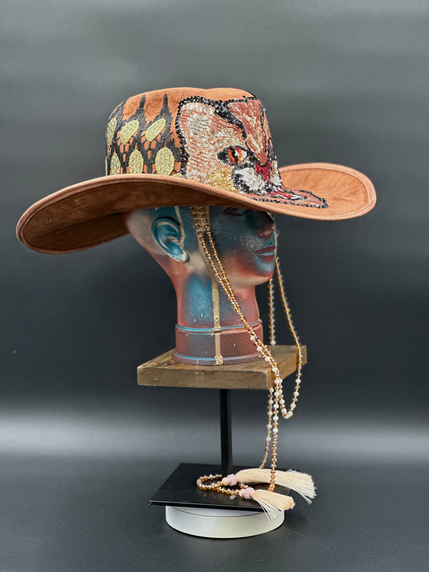 Close-up of the embroidered tiger centerpiece on the Tennessee Camel Suede Cowboy Hat, highlighting the intricate details, displayed on a mannequin head.