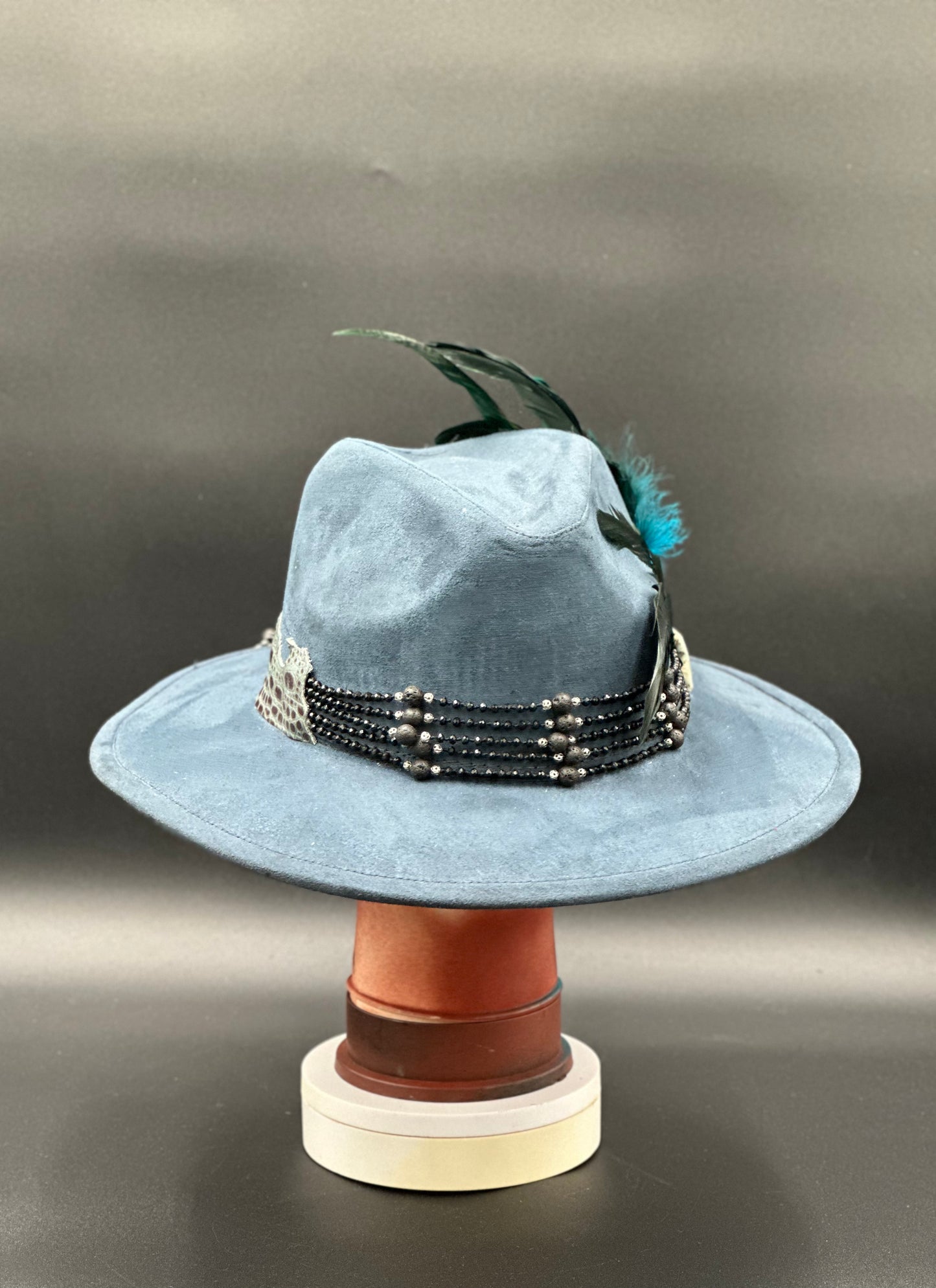 Back view of the Lisboa Blue Suede Fedora Hat on a mannequin head, showing the full design and details from the rear.