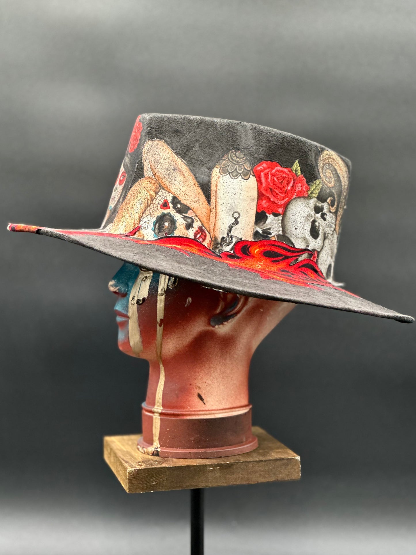 Side view of the Mazatlán Black Suede Arrow Hat on a mannequin head, highlighting the hat's unique shape and silhouette.