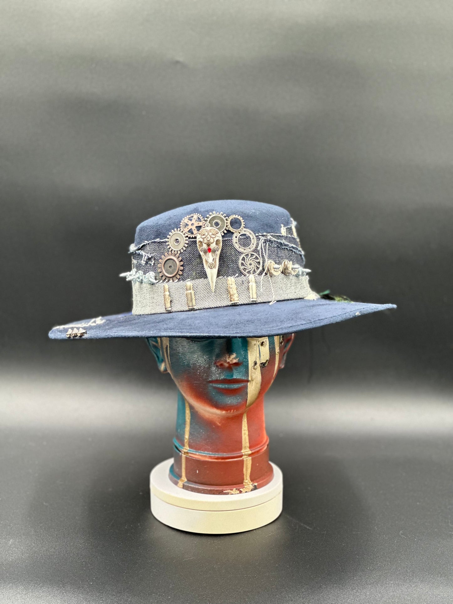 Coachella Blue Suede Cordobés Hat with steampunk gears, denim details, and charming accents. Front view of the hat showing the full design.