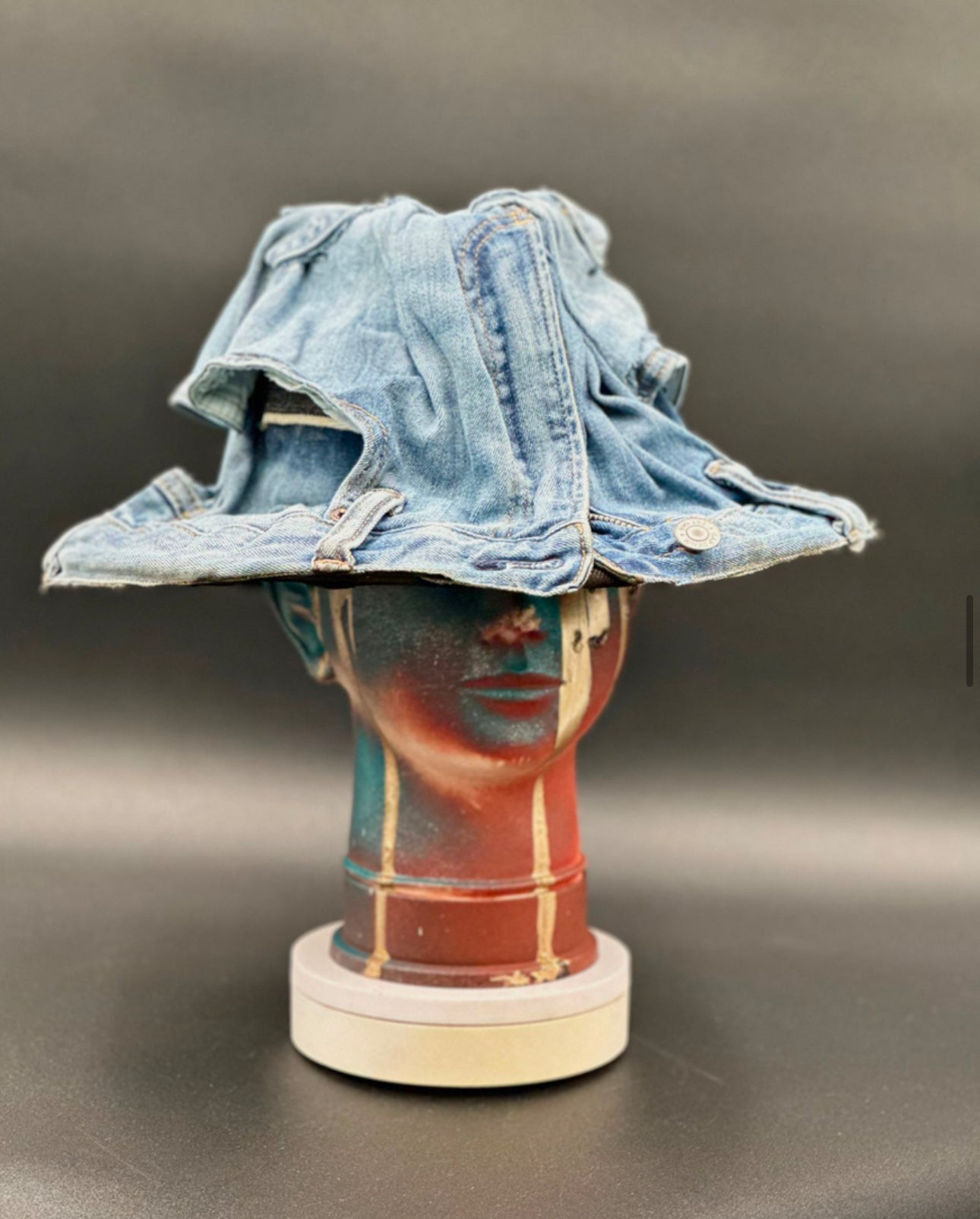 David2L Recycled Denim Hard Bucket Hat crafted from recycled denim jeans displayed on a mannequin head. Front view showing the hat's full design and shape.
