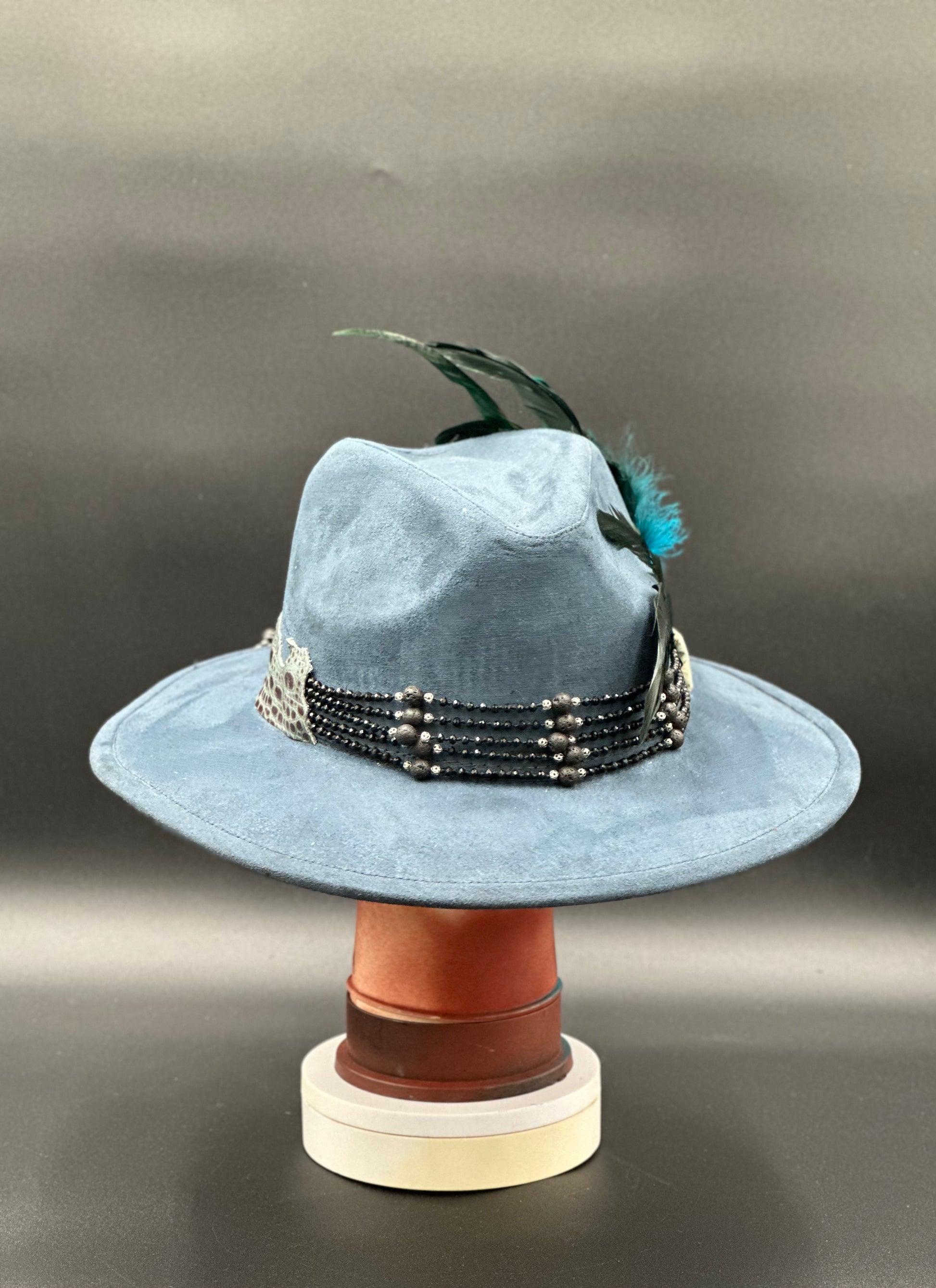 Back view of the Lisboa Blue Suede Fedora Hat on a mannequin head, showing the full design and details from the rear.