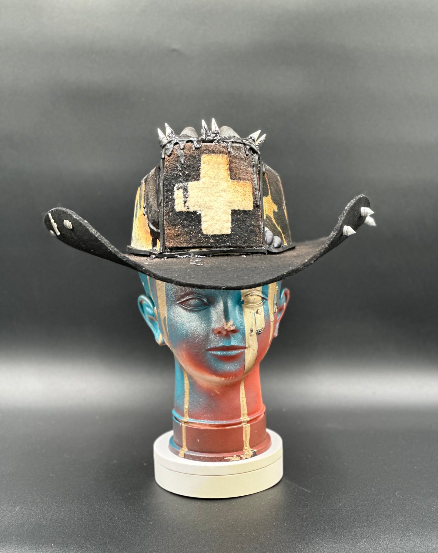 London Black Wool Cowboy Hat with cowhide prints, a wool cross detail, and spikes. Front view showing the hat's full design and shape.