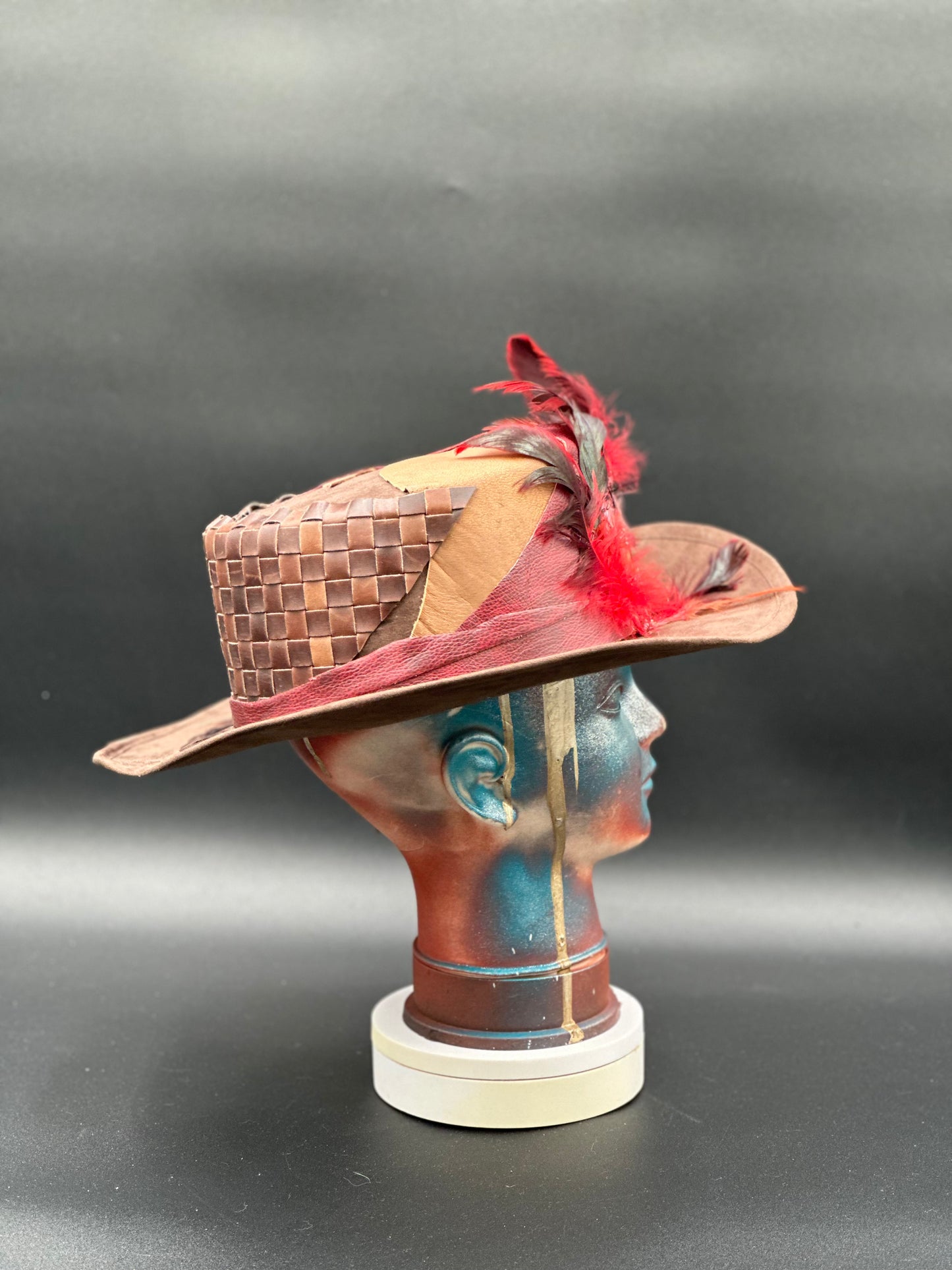 Side view of the Madagascar Crimped Tobacco Cordobés Hat, highlighting the charm placement and the hat's silhouette.