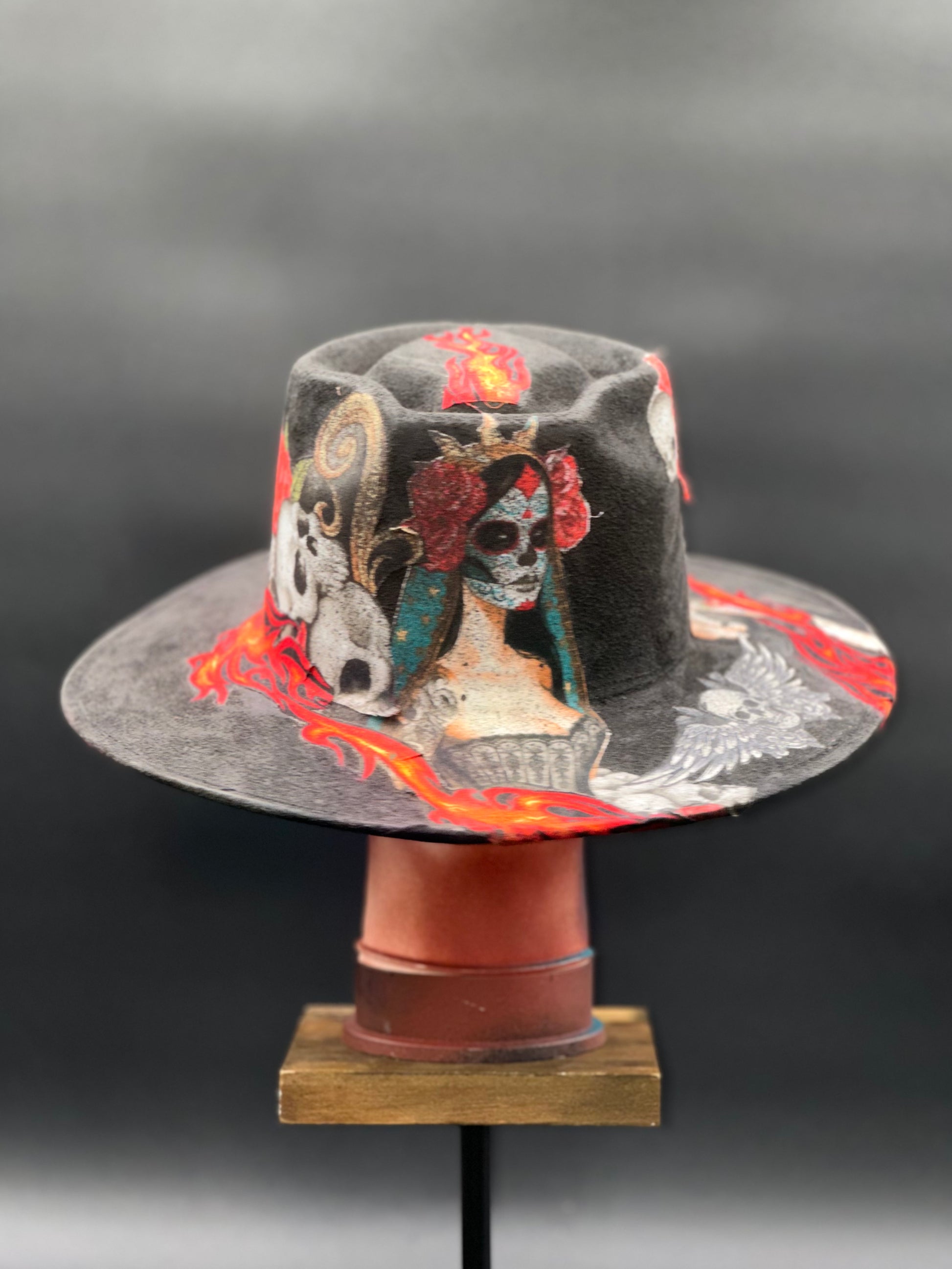 Back view of the Mazatlán Black Suede Arrow Hat on a mannequin head, showing the full design and details from the rear.