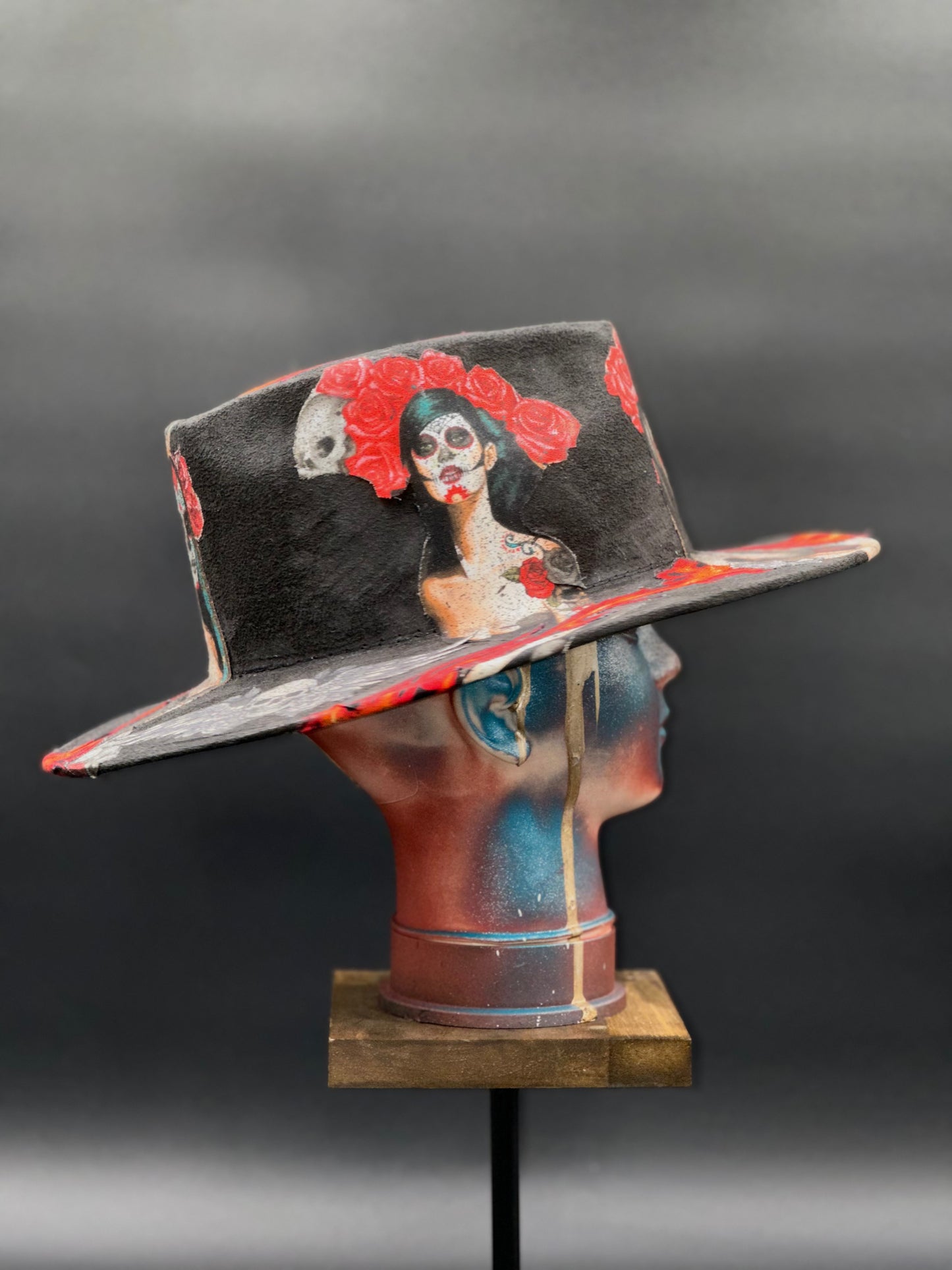 Side view of the Mazatlán Black Suede Arrow Hat on a mannequin head