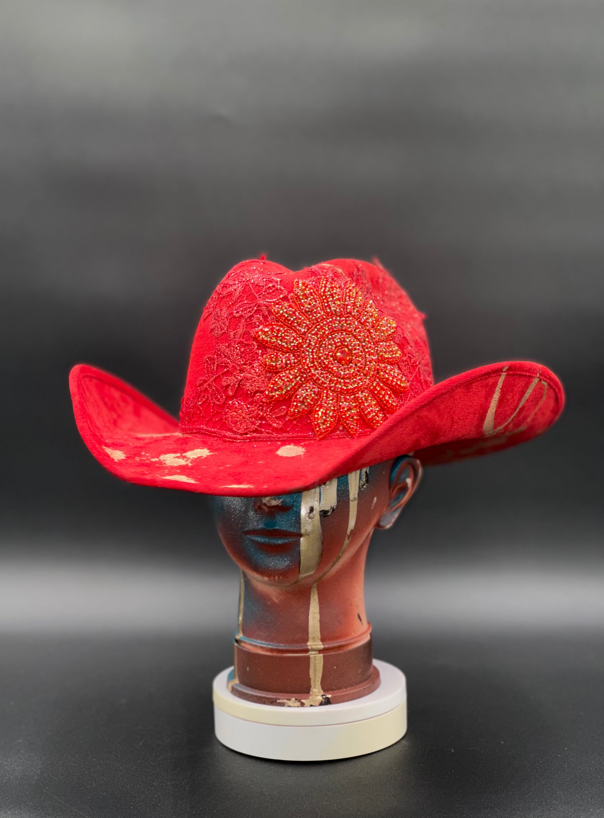 Miami Beach Red Suede Hat displayed on a mannequin head. Front view showing the hat's vibrant red color and shape.