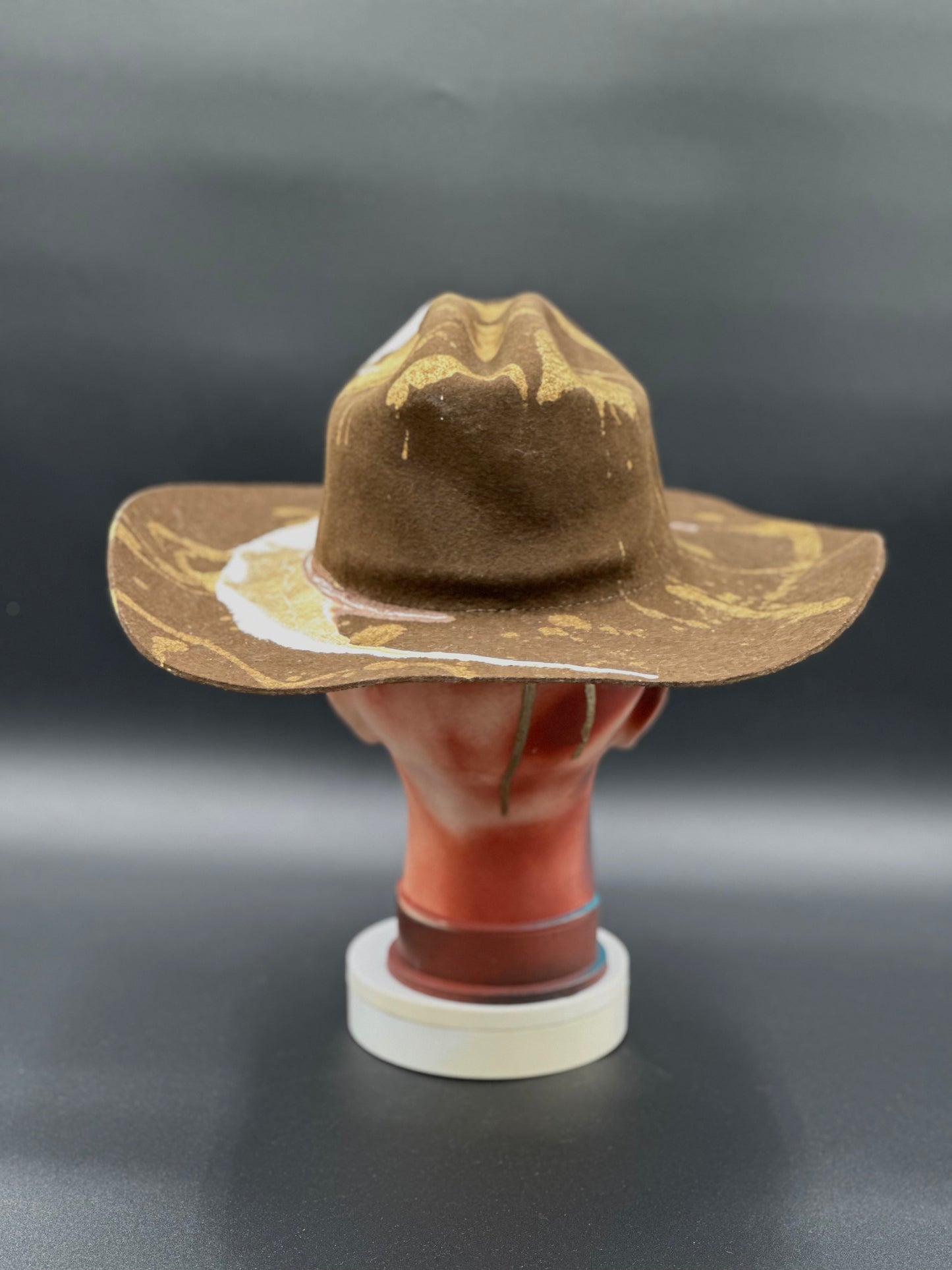 Back view of the North Carolina Tobacco Wool Cowboy Hat on a mannequin head, showing the full design and details from the rear.