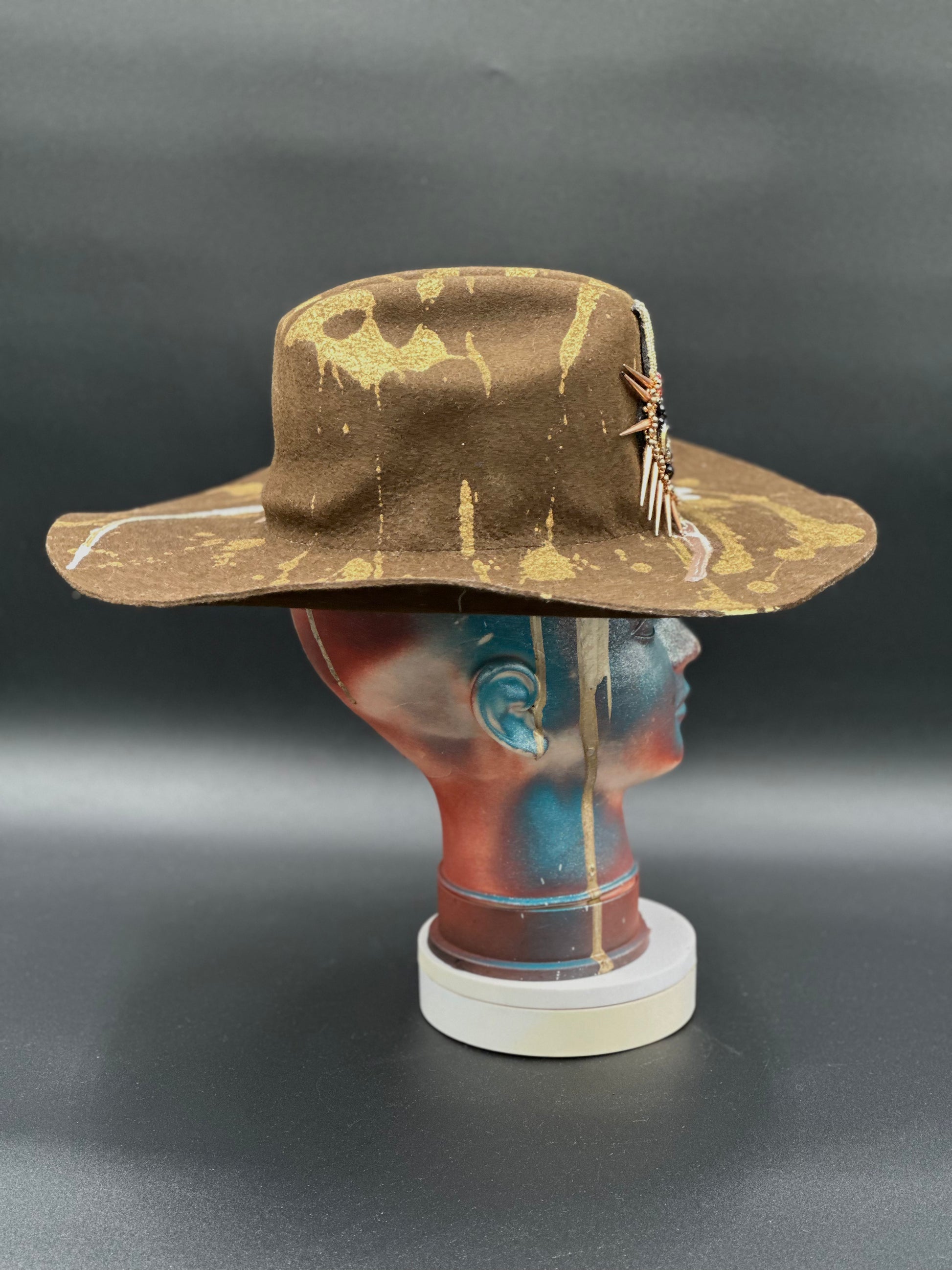 Angled view of the North Carolina Tobacco Wool Cowboy Hat on a mannequin head, displaying the texture of the wool and the placement of the pearl and gold accents.