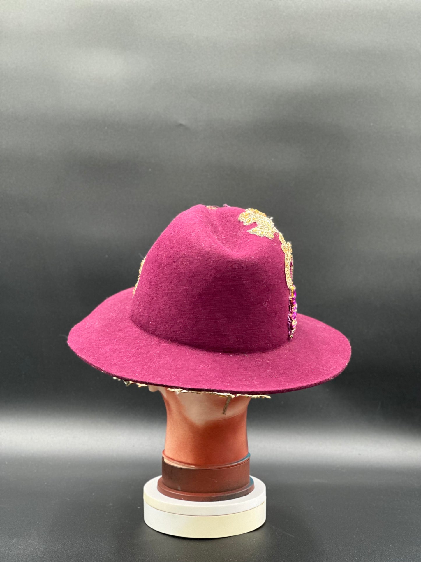 Back view of the O'porto Magenta Wool Fedora Hat on a mannequin head, showing the full design and details from the rear.