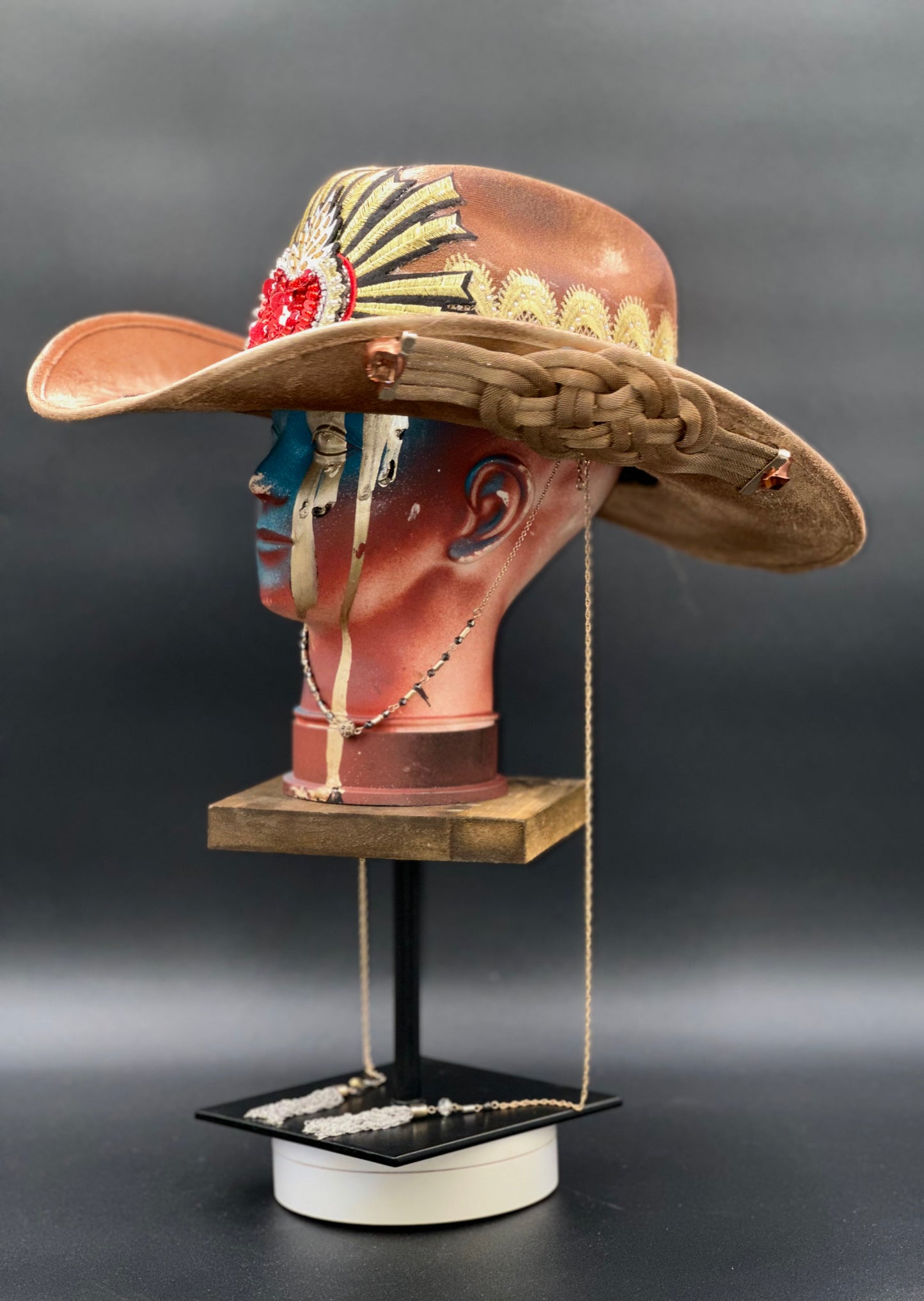Angled view of the Portugal Caramel Suede Cowboy Hat on a mannequin head, displaying the texture of the suede and the placement of the crystal accents.
