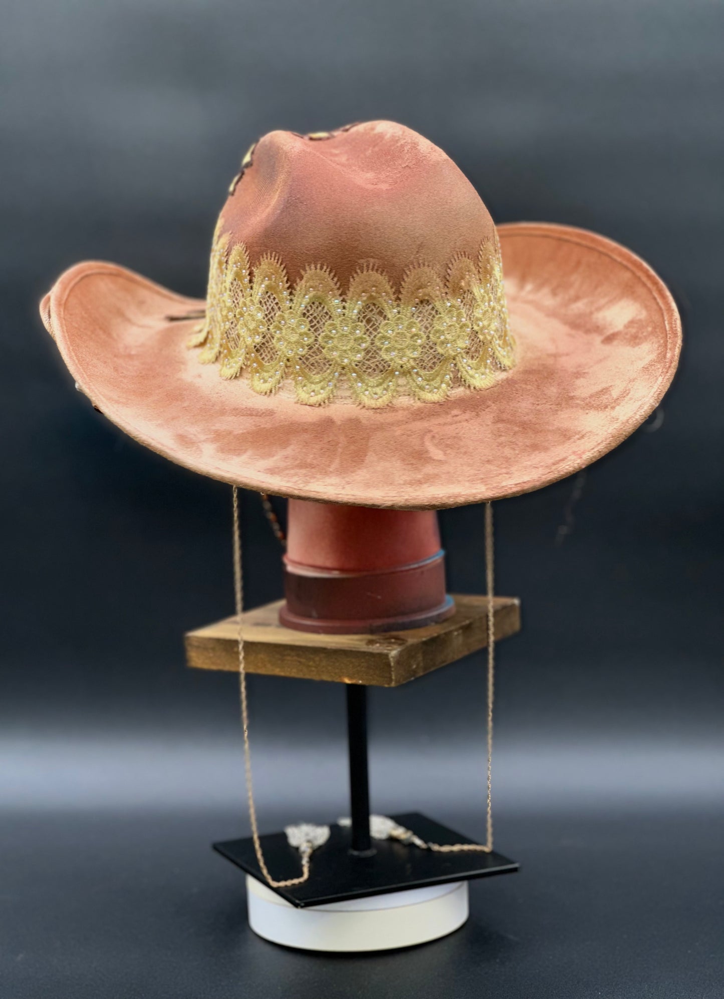 Back view of the Portugal Caramel Suede Cowboy Hat on a mannequin head, showing the full design and details from the rear.