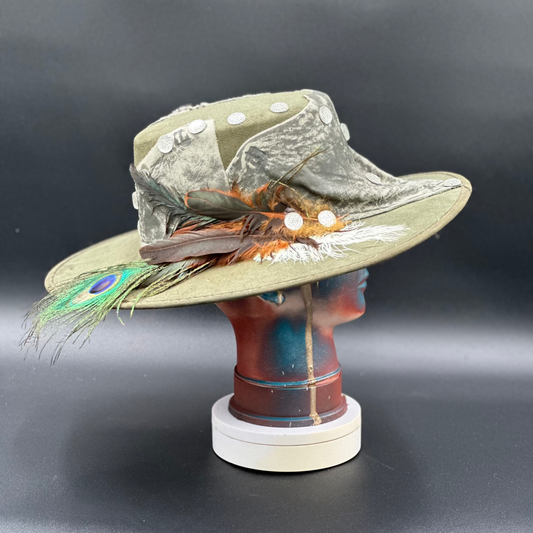 Side view of the Valencia Green Cordobés Hat, highlighting the feather placement and the hat's silhouette.