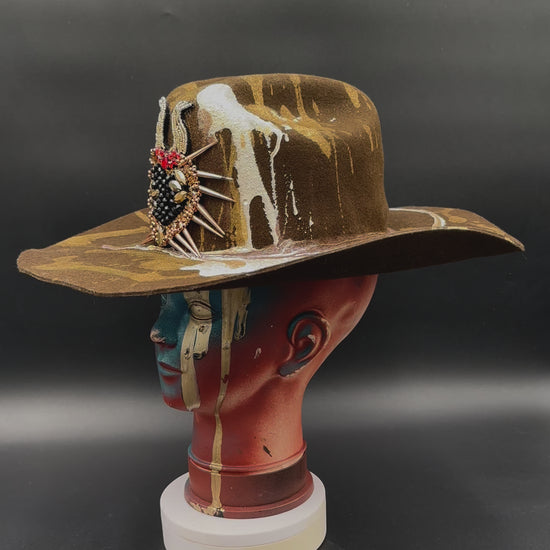 360-degree video of the North Carolina Tobacco Wool Cowboy Hat rotating on a mannequin head, showcasing the hat's full design, tobacco wool texture, pearl and gold accents, and heart-shaped spike detail from all angles.