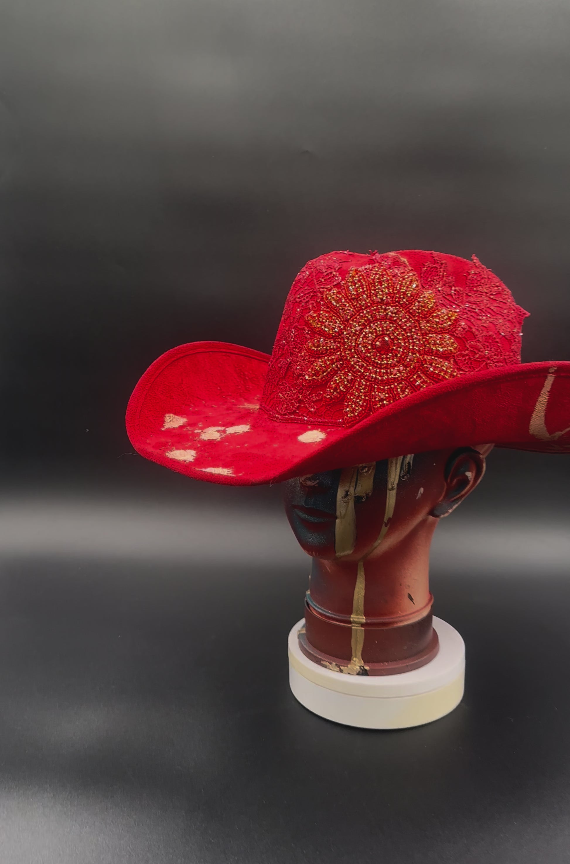 360-degree video of the Miami Beach Red Suede Hat rotating on a mannequin head, showcasing the hat's full design, red suede texture, and vibrant color from all angles.